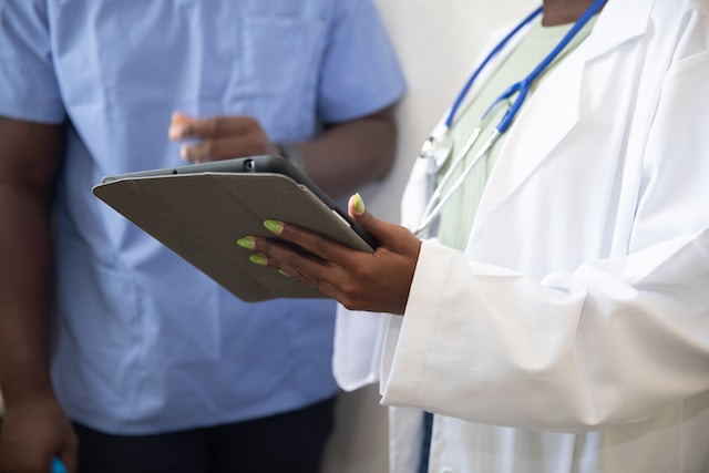 Healthcare professionals using a tablet